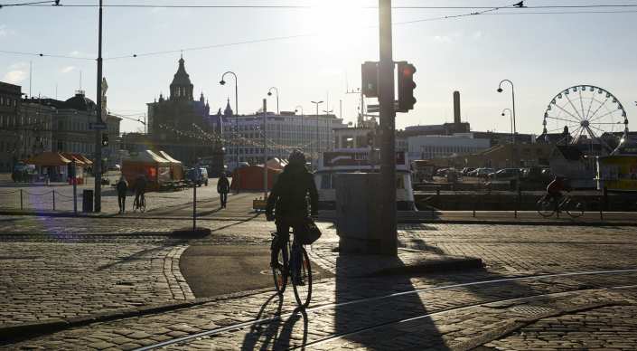 Biker crossing tram rails in Helsinki