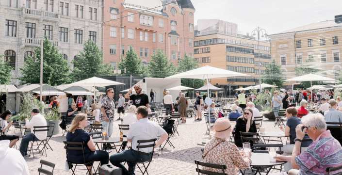 People sitting at the Kasarmitori terrace in Helsinki